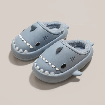 Cute gray kids' shark-shaped slippers with plush lining and thick soles, perfect for indoor use.