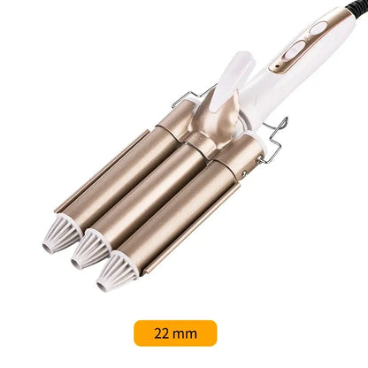 Professional hair curling tool with multiple interchangeable barrels for versatile styling. The gold-colored curling rods and white body create a sleek, modern appearance. This hair curler allows users to create a variety of curled hairstyles with ease.