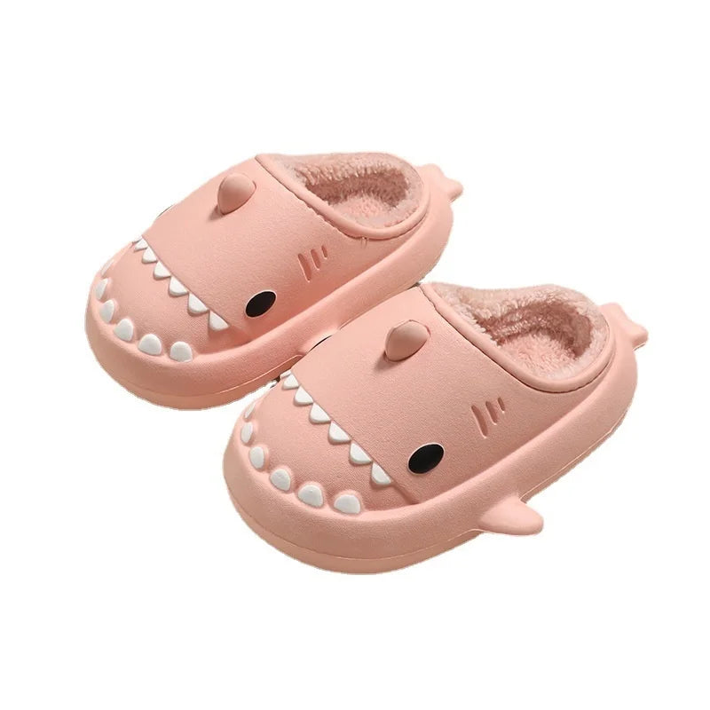 Cute pink shark-shaped children's slippers with plush lining and a thick, waterproof bottom