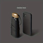 Compact folding umbrella with sleek obsidian black finish and matching smartphone case