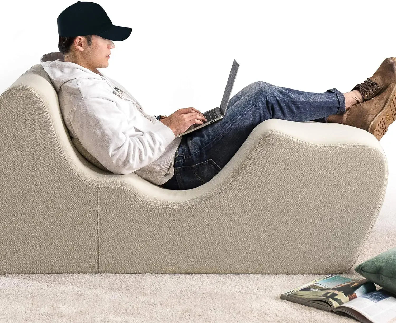 Foam recliner chair with user using laptop, offering ergonomic positioning for better relaxation, pillow included for enhanced comfort