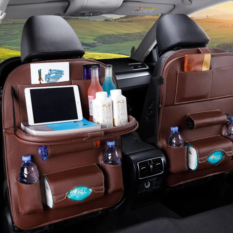 Leather car seat organizer with foldable tray, multiple pockets, and storage for accessories like tablets, drinks, and other items for a comfortable and organized driving experience.