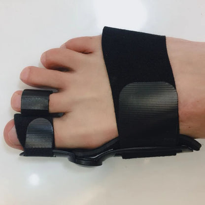 Bunion corrector foot splint for pain relief and hallux valgus treatment, black orthopedic device on human hand