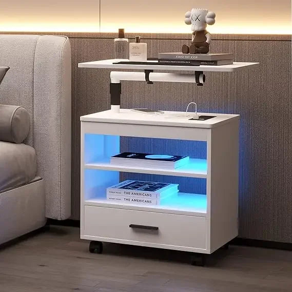 Stylish modern white nightstand with built-in storage shelves and lighting for bedroom, laptop tray, and decorative figurine.