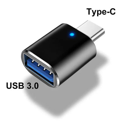 Versatile USB 3.0 Type-C adapter in sleek black metal design for high-speed data transfer between mobile devices and computers.