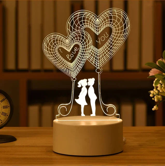 Romantic love 3D acrylic LED lamp with hearts and silhouettes of a couple, ideal as a night light, table lamp, or Valentine's Day decor.