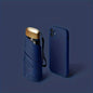 Compact navy blue folding umbrella and smartphone case on navy blue background