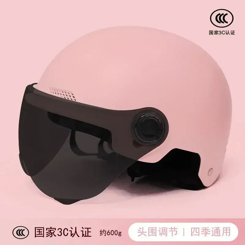 Lightweight and retro-styled motorcycle helmet in a pale pink color, designed for safe and comfortable riding on scooters, bikes, and bicycles.
