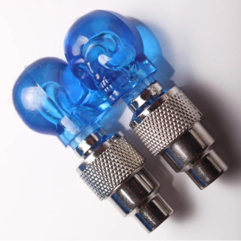 Pair of blue LED car tire valve caps with decorative neon lights for enhancing vehicle appearance and safety.