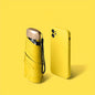 Compact UV protection umbrella and yellow smart phone on yellow background