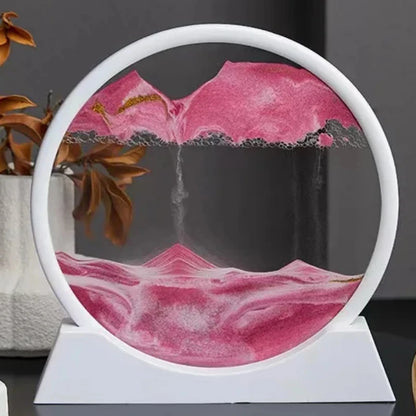 Beautiful 3D moving sand art in a round glass frame depicting a serene pink sandscape landscape with flowing sands, a creative office or home decor gift.