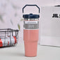 Vacuum insulated double-layer stainless steel portable water cup with handle, available in a vibrant coral color.